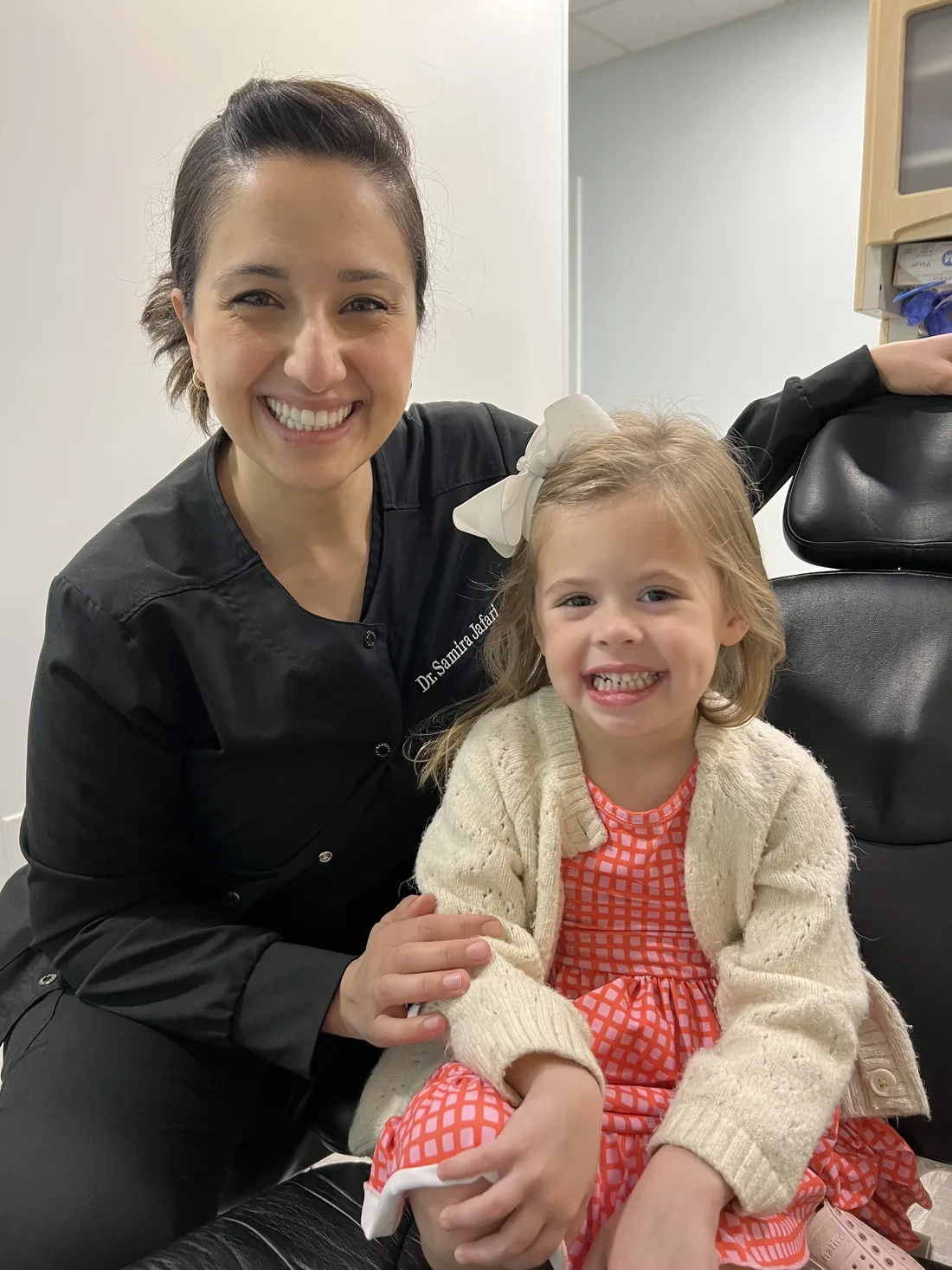 Dr. Samira Jafari with a smiling young patient