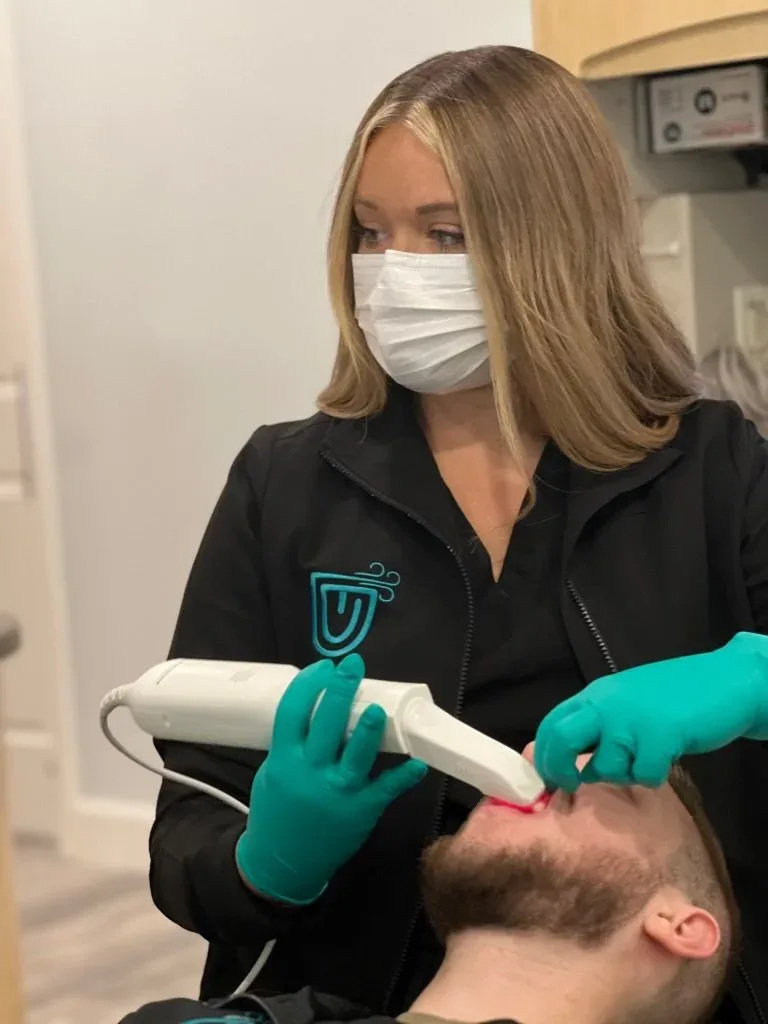 Team member using an intraoral scanner at Integrative Family Dentistry